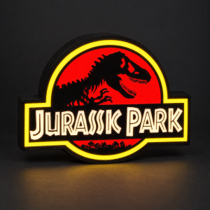 Lightbox Jurassic Park allumée, avec T-Rex noir, fond rouge, contour jaune et lettrage lumineux, sur fond sombre.